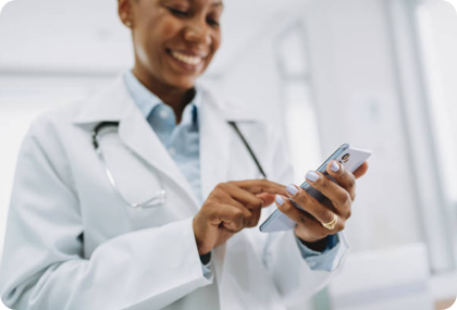 A clinician reviewing information on a smartphone.